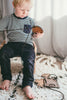 little boy with lacing toy